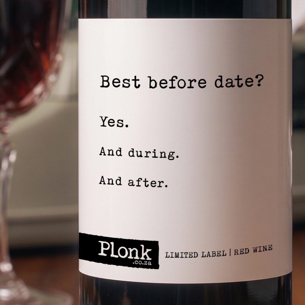 Bottle of Plonk wine showing the best before date label