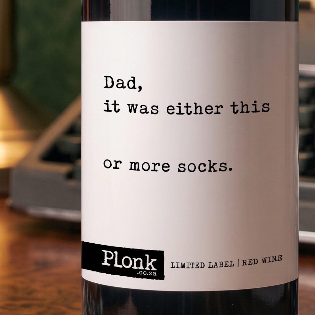 Bottle of Plonk wine showing the dad it was either this or more socks label