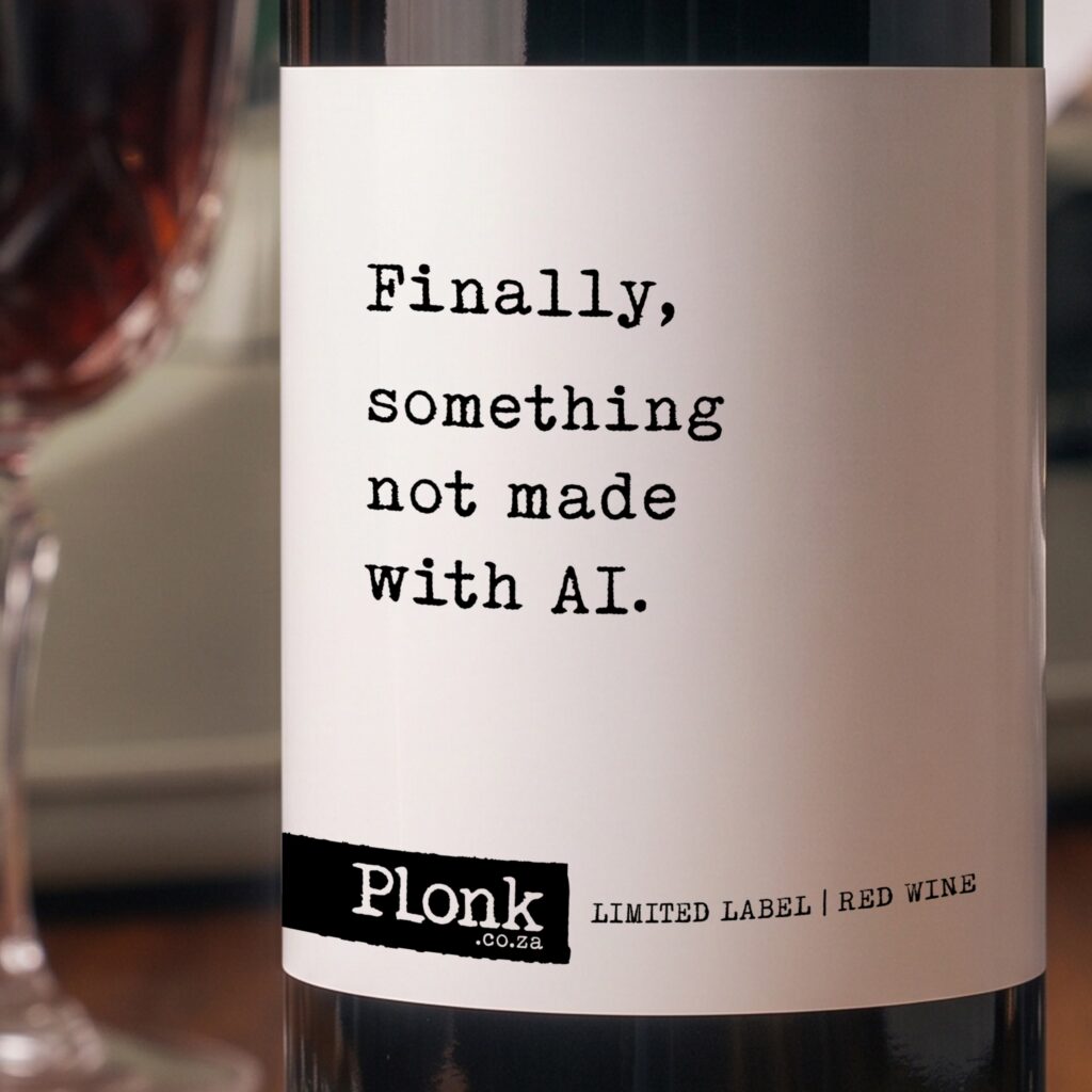 Bottle of Plonk wine showing the finally something not made with ai label