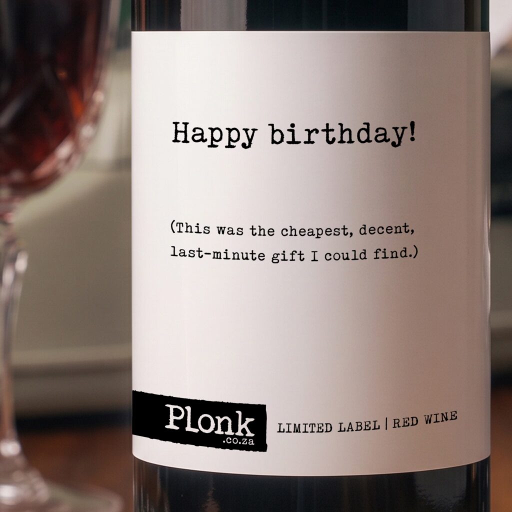 Bottle of Plonk wine showing the happy birthday this was the cheapest decent last minute gift I could find label