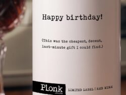 Bottle of Plonk wine showing the happy birthday this was the cheapest decent last minute gift I could find label