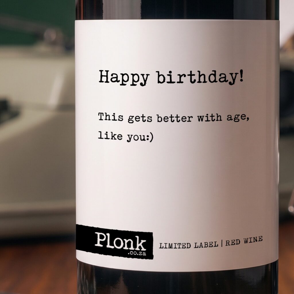 Bottle of Plonk wine showing the happy birthday this gets better with age like you label