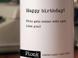 Bottle of Plonk wine showing the happy birthday this gets better with age like you label