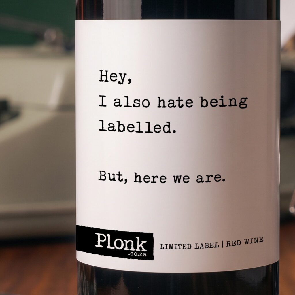 Bottle of Plonk wine showing the hey I also hate being labelled but here we are label