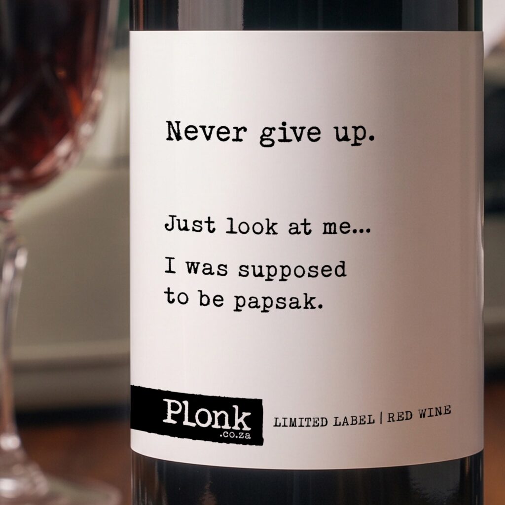 Bottle of Plonk wine showing the never give up just look at me i was supposed to be papsak label