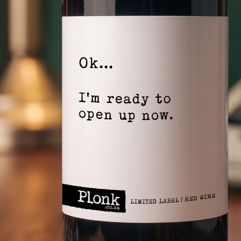 Bottle of Plonk wine showing the ok i'm ready to open up now label