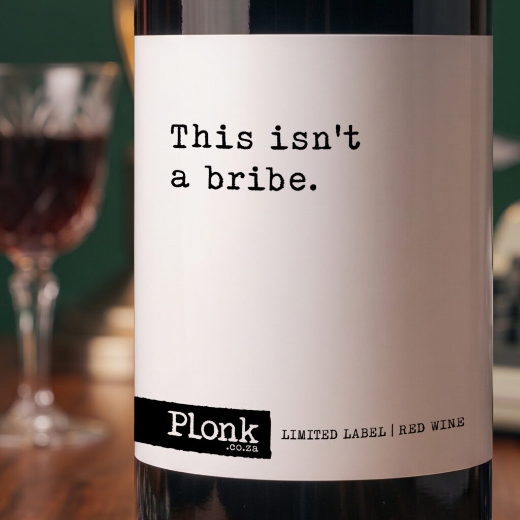 Bottle of Plonk wine showing the this isnt a bribe label